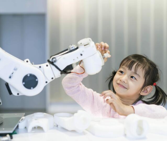little Girl Building Robotic Arm At School